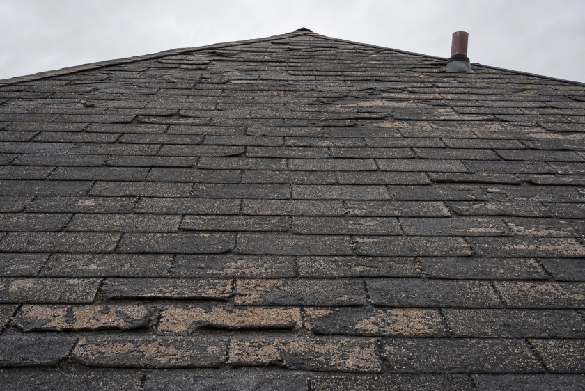 Aging asphalt shingle roof with granule loss that needs full replacement