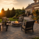 Finished paver patio in a Northern Virginia backyard at golden hour with fire pit - paver patio cost guide